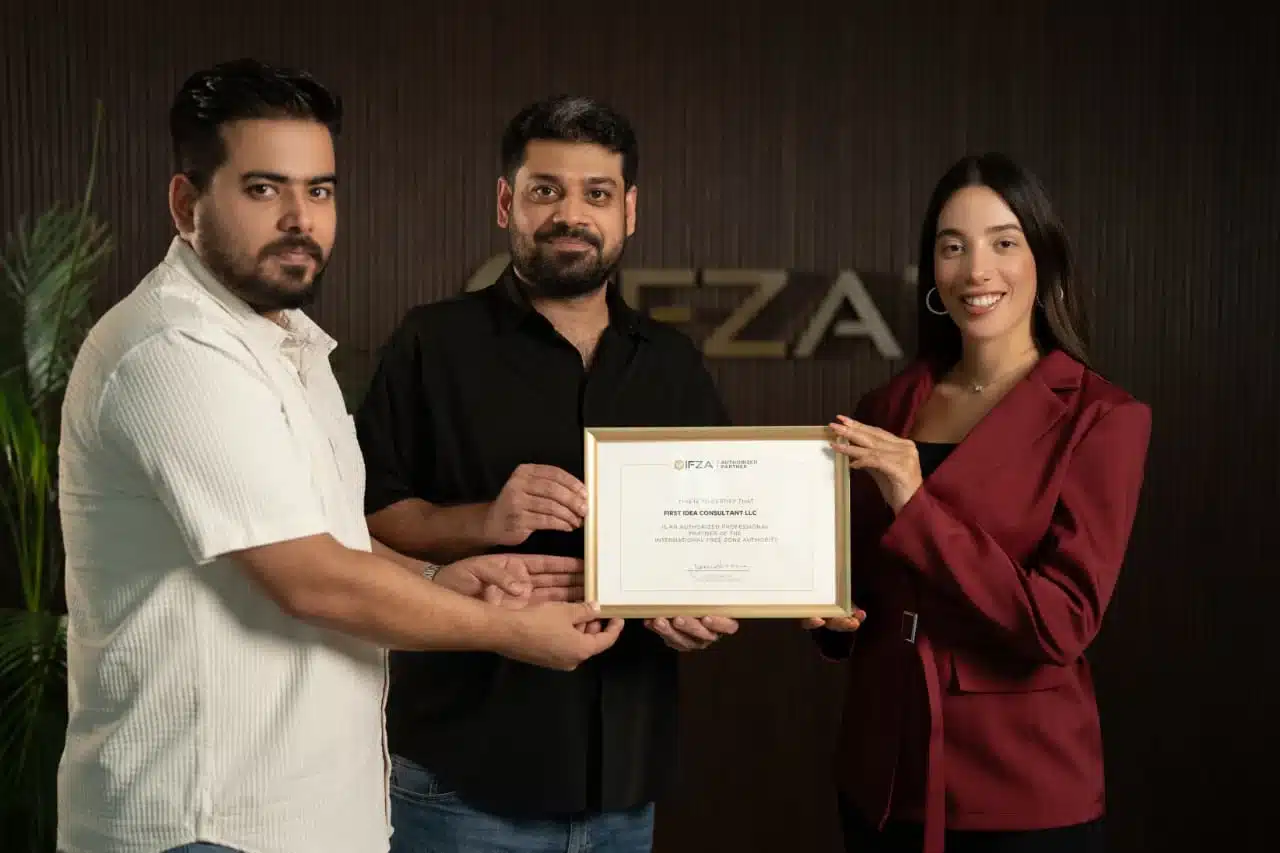 The First Idea Consultant team holding the IFZA Authorised Partner certificate